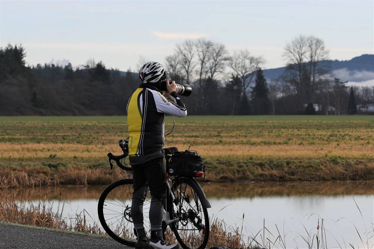 photographer, camera, cyclist, bicycle, rider, man, male photographer, valley, street, nature, mountains, outdoors, photography. Cycling weekends field kit: pack a camera to survive