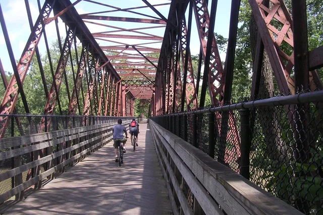 Norwottuck Rail Trail Bridge, Northampton Massachusetts. Mapping a two-day rail trail itinerary around access points and town spacing