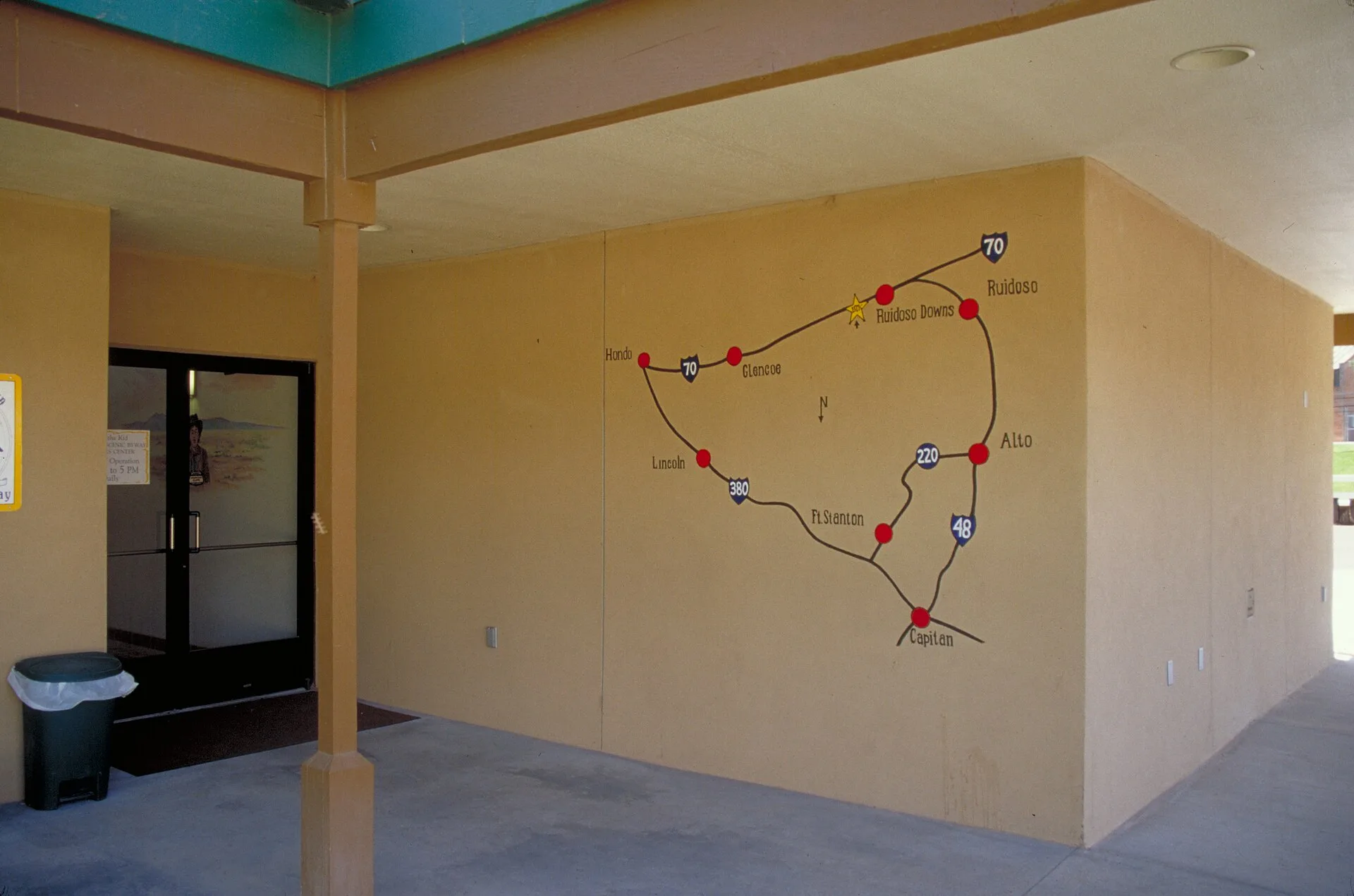 Scope and content: The original finding aid described this photograph as: Original Caption: Lost? Check out this Billy the Kid Trail map on an outside wall at the byway visitor center in Ruidoso Downs. Location: Ruidoso Downs, New Mexico (33.331° N 105.596° W) Status: Public domain. Photo by Dennis. How to find the people who actually know a trail town: the honest picture