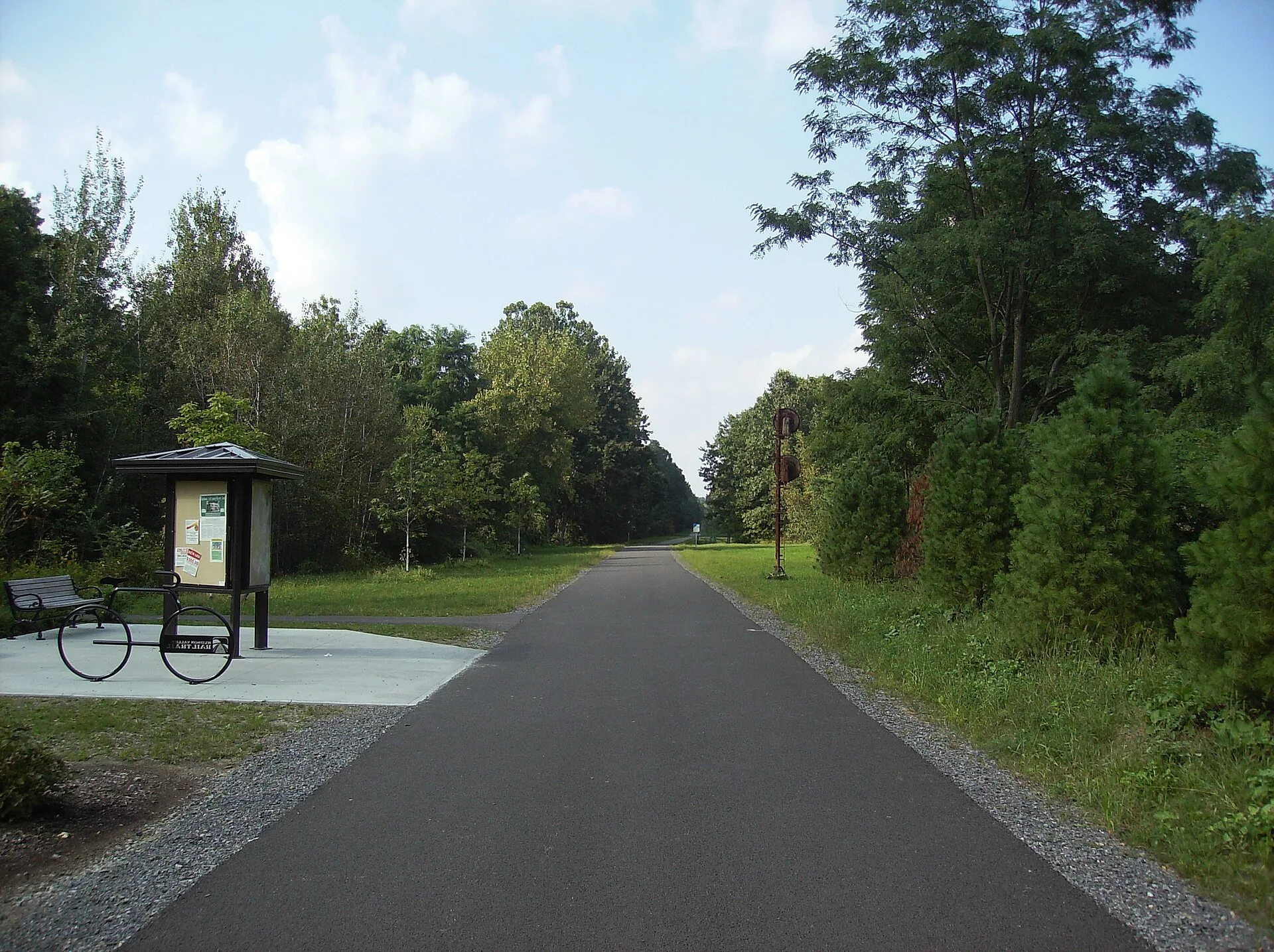 The trailhead at the Commercial Avenue parking lot, along the Hudson Valley Rail Trail in the hamlet of Highland in the town of Lloyd, New York. Rail Trail Town Parking: General Planning Tips
