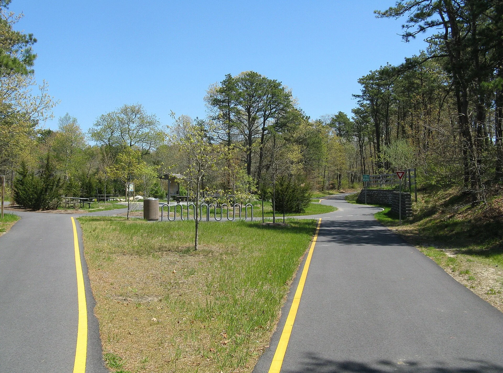 Cape Cod Rail Trail Rotary, Harwich Massachusetts Intersection with Old Colony Rail Trail to Chatham. Rail trail travel places to stay: base towns and campsites