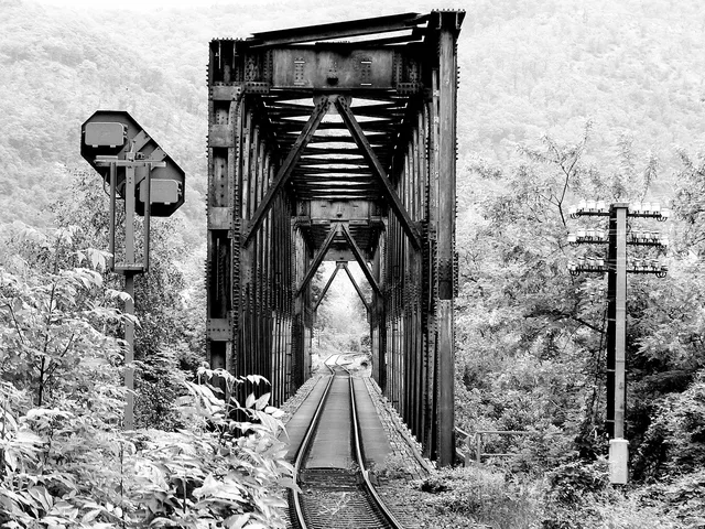 bridge, railway bridge, rail, rail track, railroad, railway, countryside, black and white, bridge, bridge, bridge, bridge, bridge, railway. How lodging choice quietly drives a rail trail trip's total cost